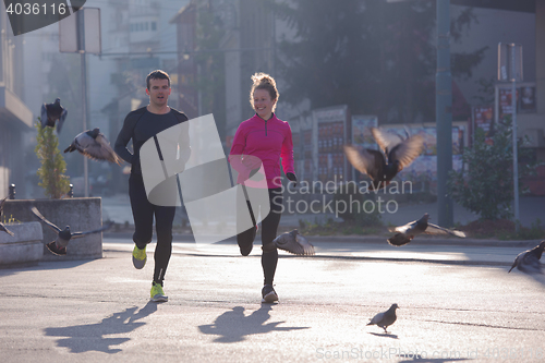 Image of young  couple jogging