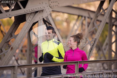 Image of young  couple jogging