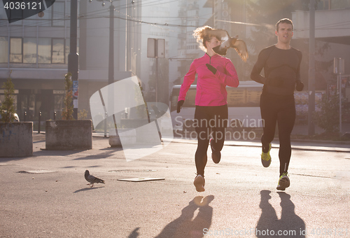Image of young  couple jogging