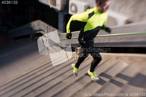 Image of man jogging on steps