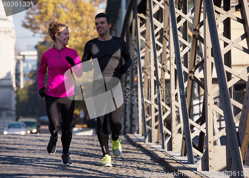 Image of young  couple jogging