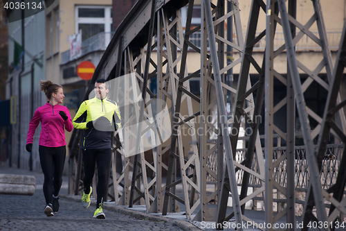 Image of young  couple jogging