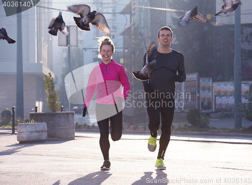 Image of young  couple jogging