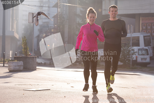 Image of young  couple jogging
