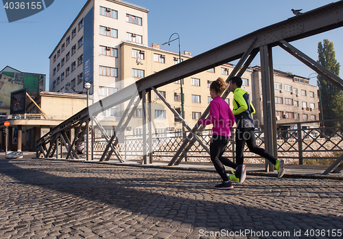 Image of young  couple jogging