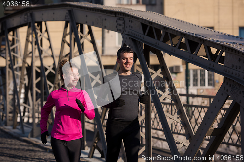 Image of young  couple jogging