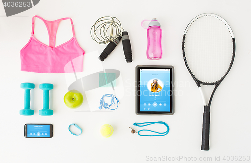 Image of tablet pc, smartphone and sports stuff