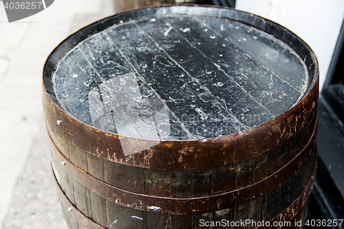 Image of close up of old wooden barrel outdoors