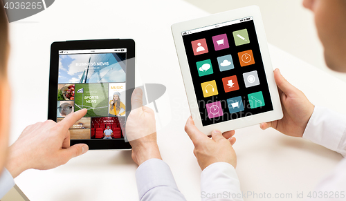 Image of close up of businessman hands with tablet pc