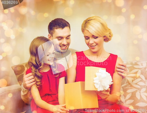 Image of happy family opening gift box