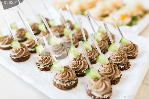 Image of close up of canape with paste on serving tray