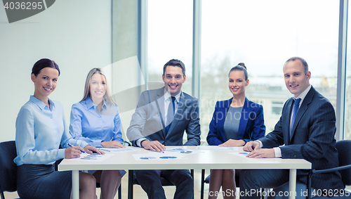 Image of smiling business team at meeting