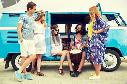 Image of hippie friends with tom-tom playing music over car