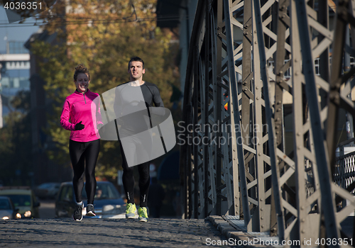 Image of young  couple jogging