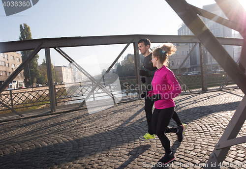 Image of young  couple jogging