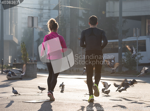 Image of young  couple jogging