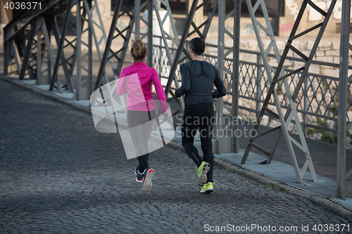 Image of young  couple jogging