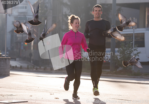 Image of young  couple jogging