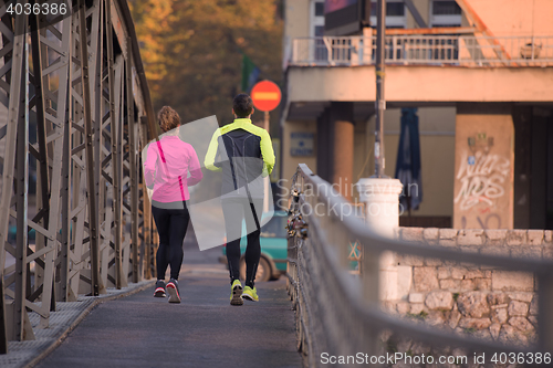 Image of young  couple jogging