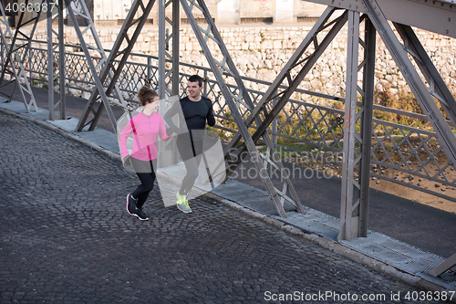 Image of young  couple jogging