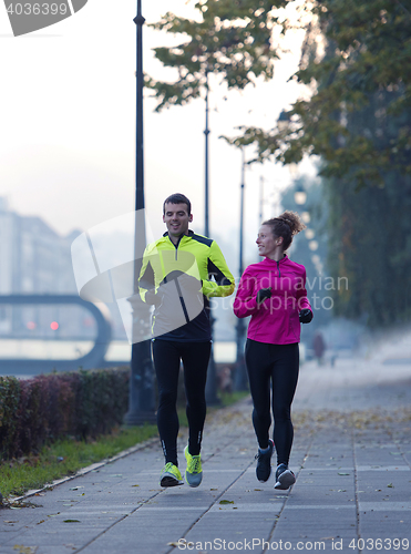 Image of young  couple jogging