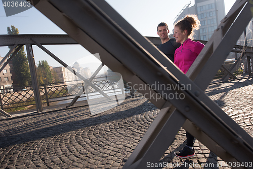 Image of young  couple jogging