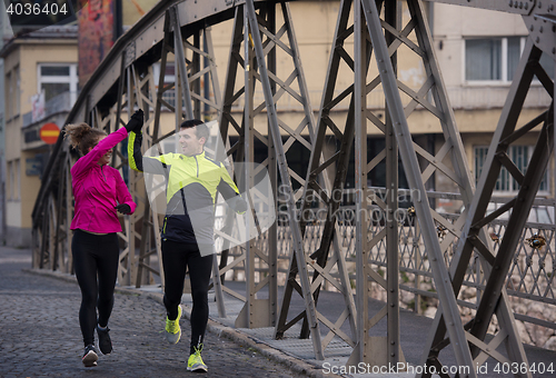 Image of young  couple jogging