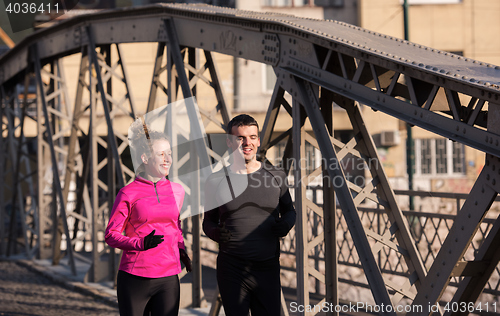 Image of young  couple jogging