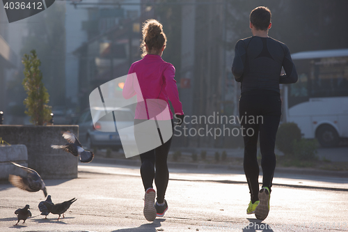 Image of young  couple jogging
