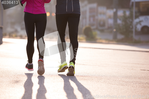 Image of young  couple jogging