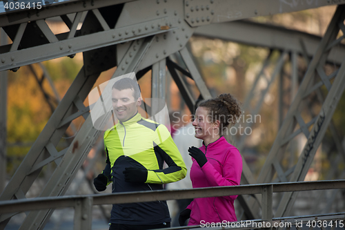 Image of young  couple jogging