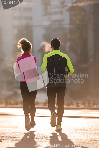 Image of young  couple jogging