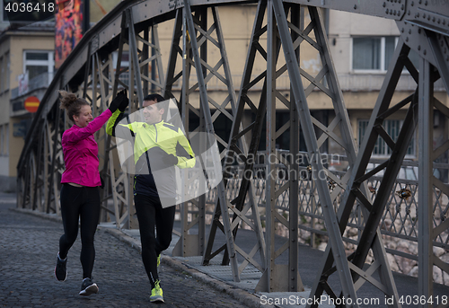 Image of young  couple jogging