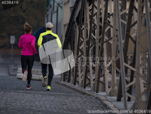 Image of young  couple jogging