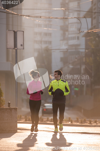 Image of young  couple jogging
