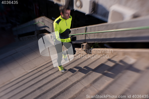 Image of man jogging on steps