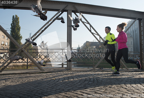 Image of young  couple jogging