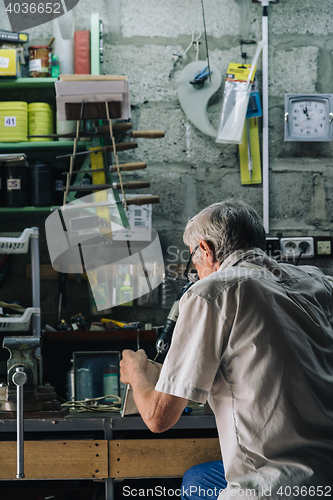 Image of Senior mechanic working in garage