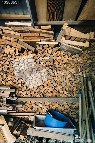 Image of Stack of dry firewoods indoor