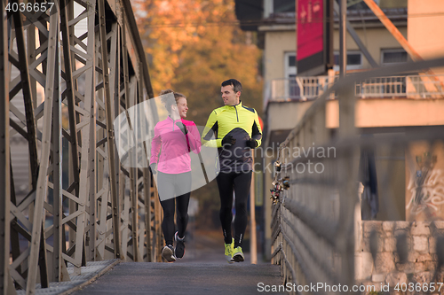 Image of young  couple jogging