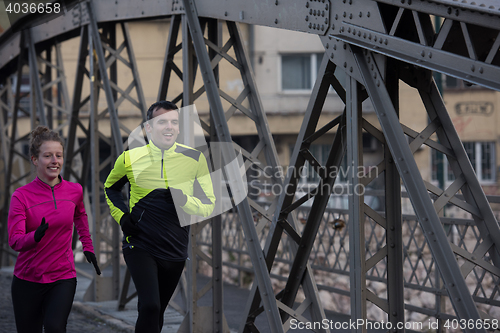 Image of young  couple jogging