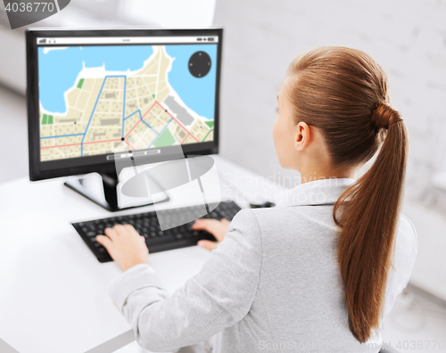 Image of businesswoman with gps navigator map on computer