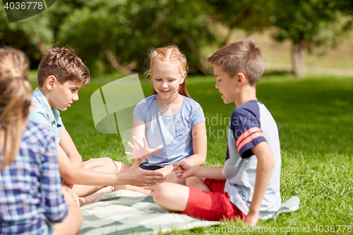 Image of happy kids playing rock-paper-scissors game