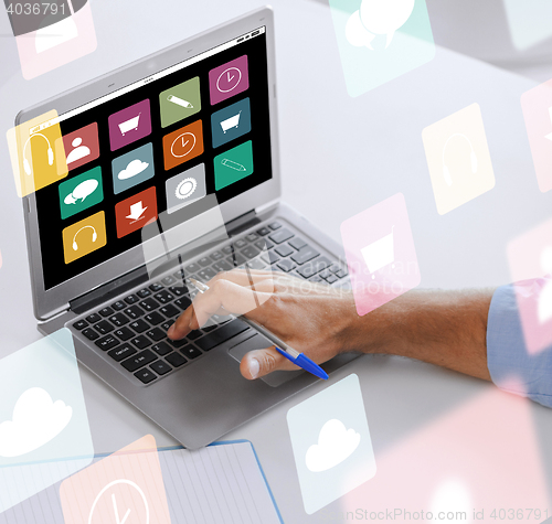 Image of businessman with laptop computer working at office