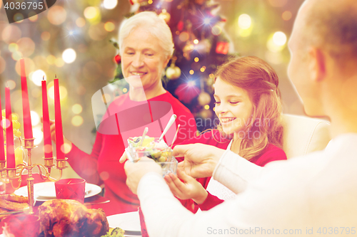 Image of smiling family having holiday dinner at home