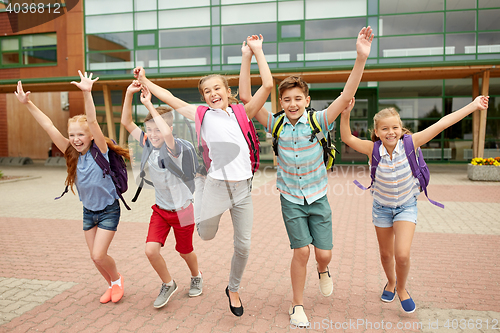 Image of group of happy elementary school students running