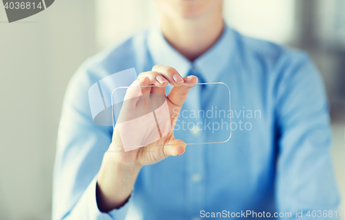 Image of close up of woman with transparent smartphone