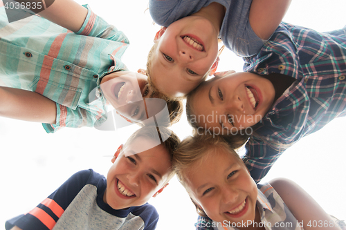 Image of group of happy children faces in circle