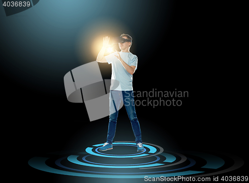 Image of happy man in virtual reality headset or 3d glasses