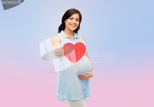 Image of happy pregnant woman with red heart touching belly